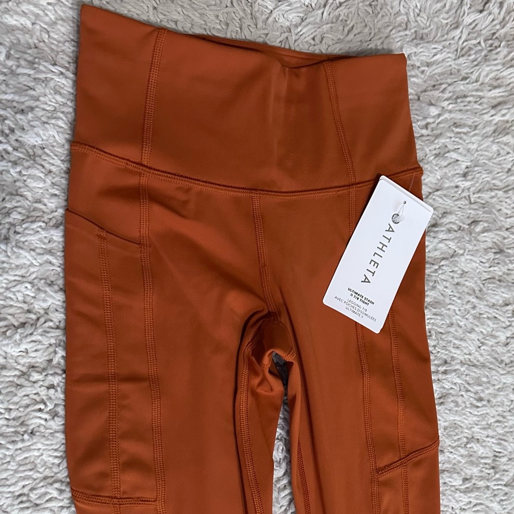 Athleta Ultimate stash II 7/8 tight legging $109 size XXS dark orange
